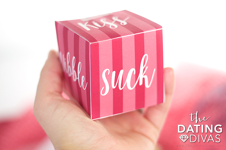 A homemade sex dice held in someone's hand | The Dating Divas