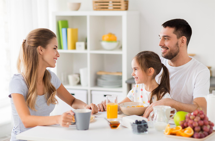 Eat breakfast together for a happy morning routine.