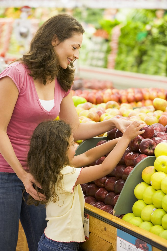 Mother and daughter in produce section