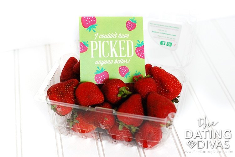 A carton of strawberries topped with a romantic scavenger hunt note | The Dating Divas