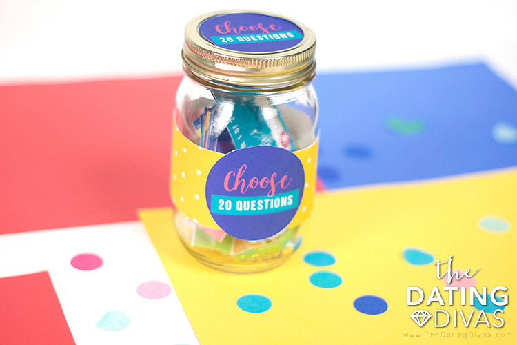 jar full of Questions for Couples Game on colored paper