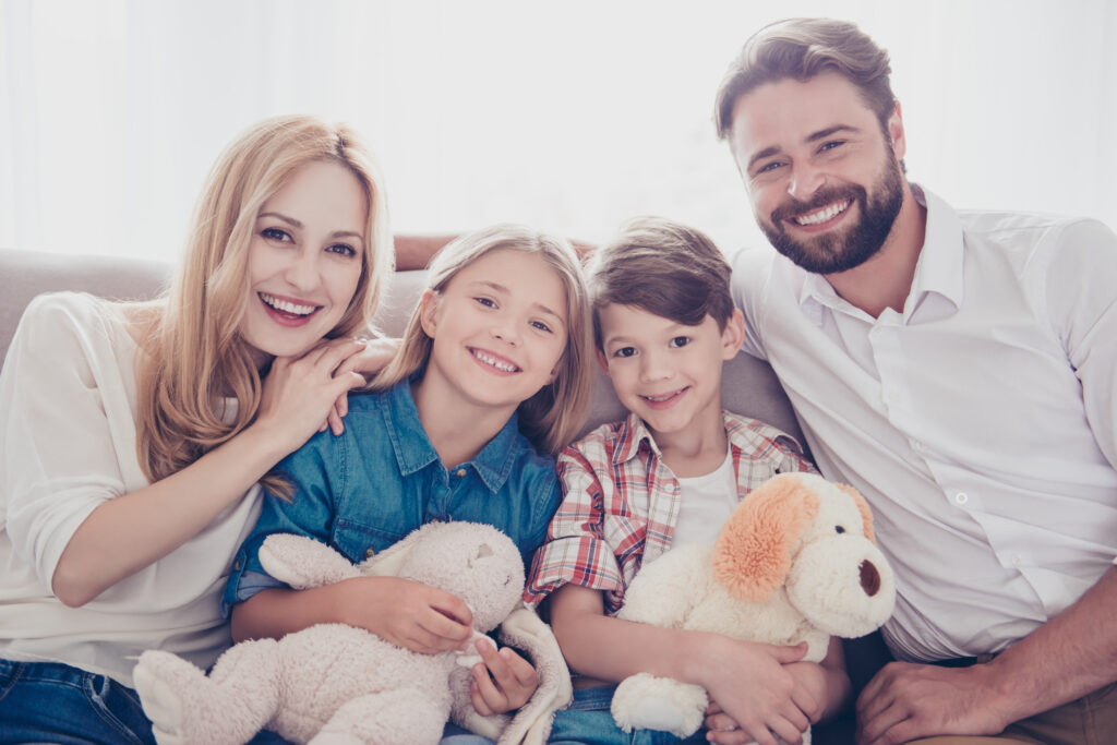 Smiling Kids with Stuffed Animals