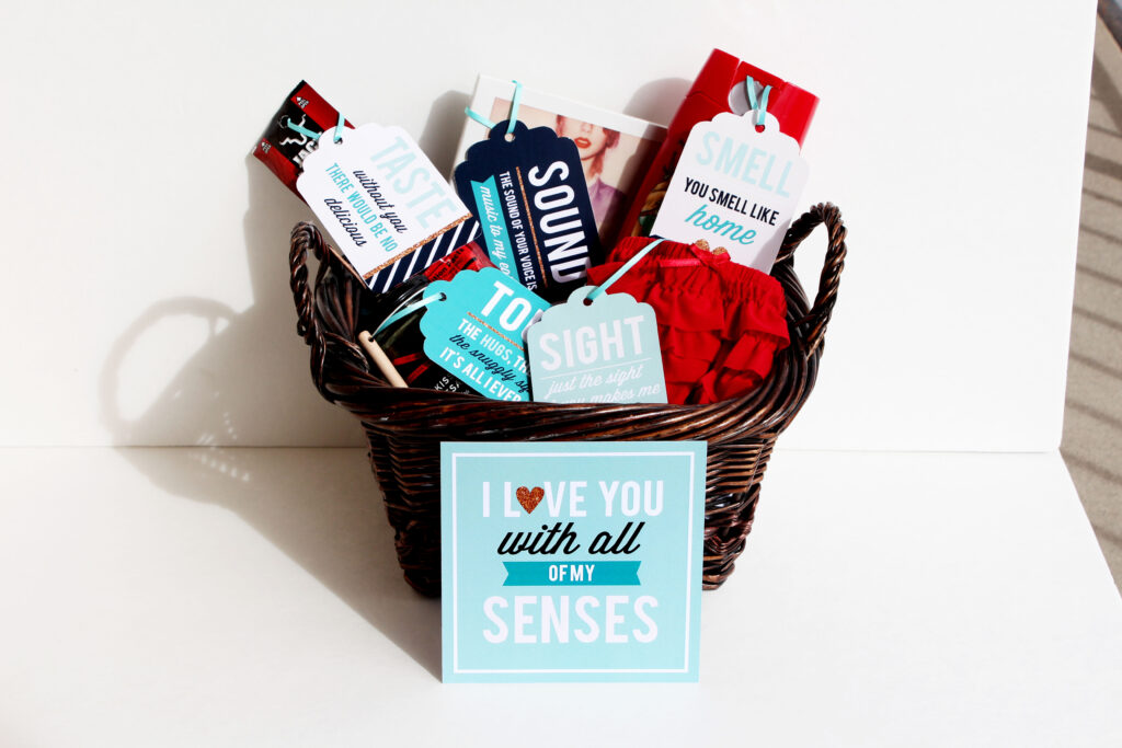 A basket filled with anniversary gifts for him that are all about the five senses. | The Dating DIvas