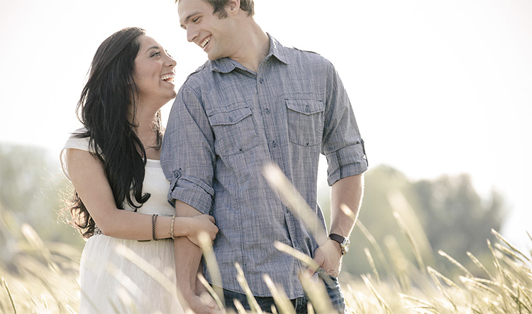 A Couple Standing Outside and Hugging with Eyes Closed · Free Stock Photo