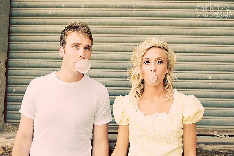 Couple blows bubble gum bubbles. | The Dating Divas