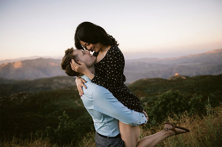 A couple seen kissing as they pose during a photo session on the street.  The association 'ASIMAS Malaga' that promotes health measures of prevention  against AIDS and others illness STD, organized a