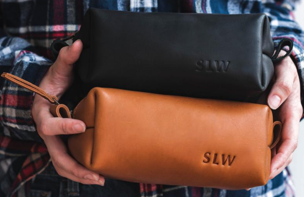 This personalized leather toiletry bag is a great anniversary gift for him. | The Dating Divas