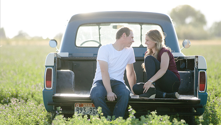 Sitting in a truck bed for a portrait. | The Dating Divas