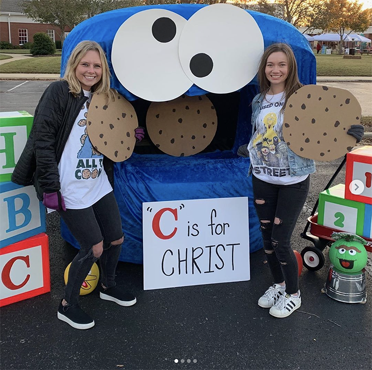 A trunk decorated as Cookie Monster with a sign that reads "C is for Christ" This is a simple and fun idea for a church trunk or treat party | The Dating Divas