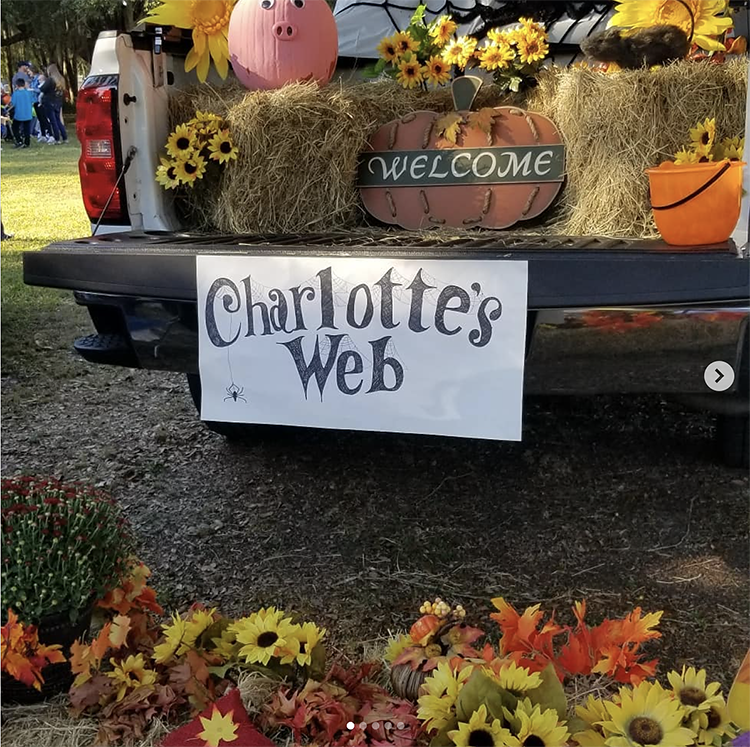 Trunk decorated with a Charlotte's Web theme including fall decor. This is a great trunk or treat idea | The Dating Divas