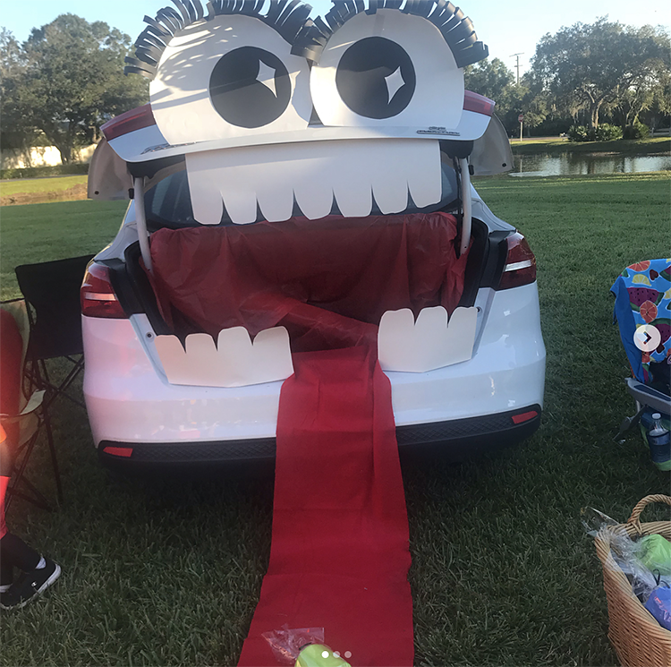 A trunk decorated as a large mouth of a classic Halloween monster. The trunk is the mouth of the monster. This is a very popular and easy trunk or treat idea. | The Dating Divas