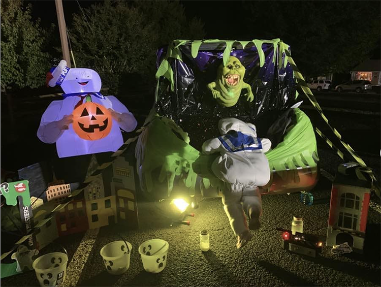 Trunk decorated with a theme for the movie Ghostbusters. It includes characters from the movie. This is a great trunk or treat idea | The Dating Divas