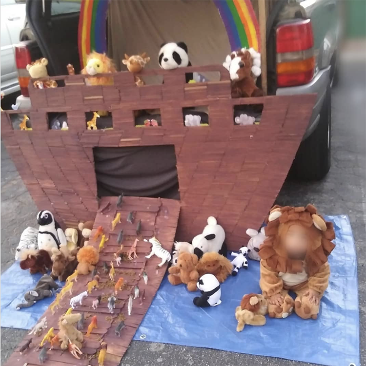 A trunk decorated a the arc of Noah. It has stuffed animals entering boat from the ramp and a large rainbow across the top of the car's trunk. This makes a perfect trunk or treat theme for a church Halloween activity. | The Dating Divas