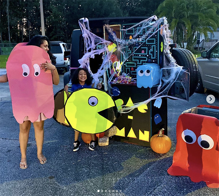 A trunk decorated with a theme from the arcade game Pacman. The trunk decoration include a scene from the classic game and the family has Pacman character costumes to match the theme. This is a super fun theme for Trunk or Treat. | The Dating Divas