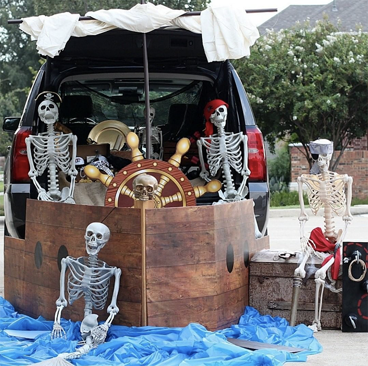 A trunk decorated as a large pirate ship manned by skeletons. A fun trunk or treat theme idea. |The Dating Divas