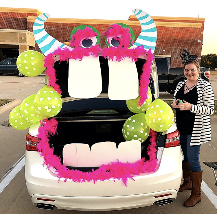 A trunk decorated as a large mouth of a silly monster. The trunk is the mouth of the monster. This is a very popular and easy trunk or treat idea. | The Dating Divas