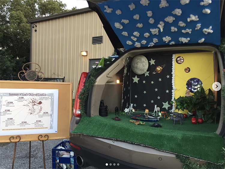 A trunk decorated with representations of the creation as recorded in Genesis in the Bible. This is a unique trunk or treat idea for a church activity. | The Dating Divas