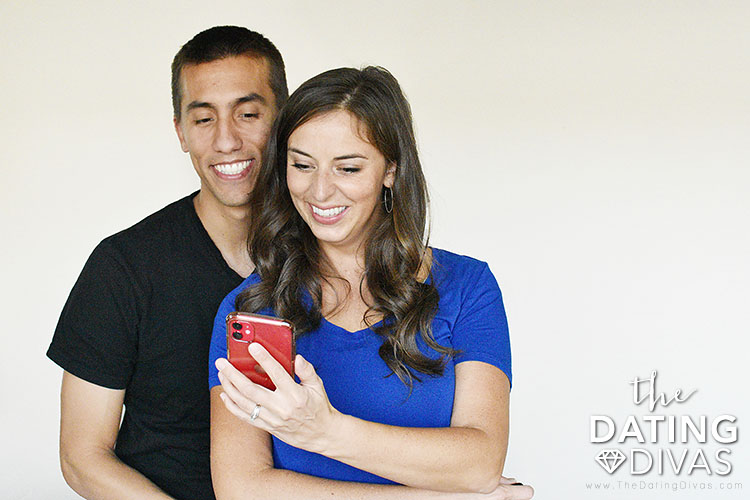 Couple looking at the app "Intimately Us"  - a fun and sexy app for couples.  . | The Dating Divas 