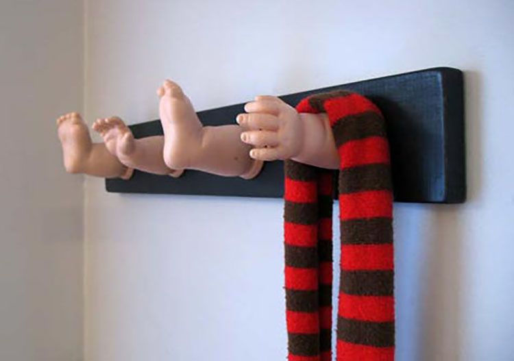 Arm and leg coat rack made from dolls that you can give as white elephant gifts. | The Dating Divas 