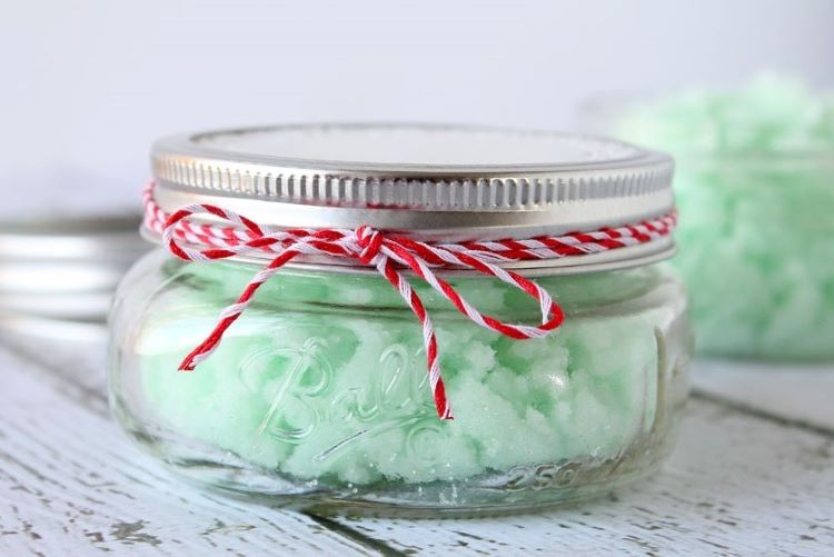 Homemade mint sugar scrub in a small glass jar tied with baker's twine | The Dating Divas