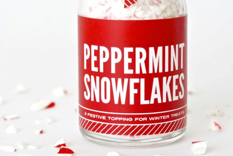 A jar of small candy cane pieces that are called Peppermint Snowflakes | The Dating Divas