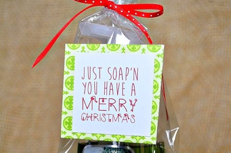 A bottle of soap wrapped in cellophane with a punny Christmas tag on the front | The Dating Divas