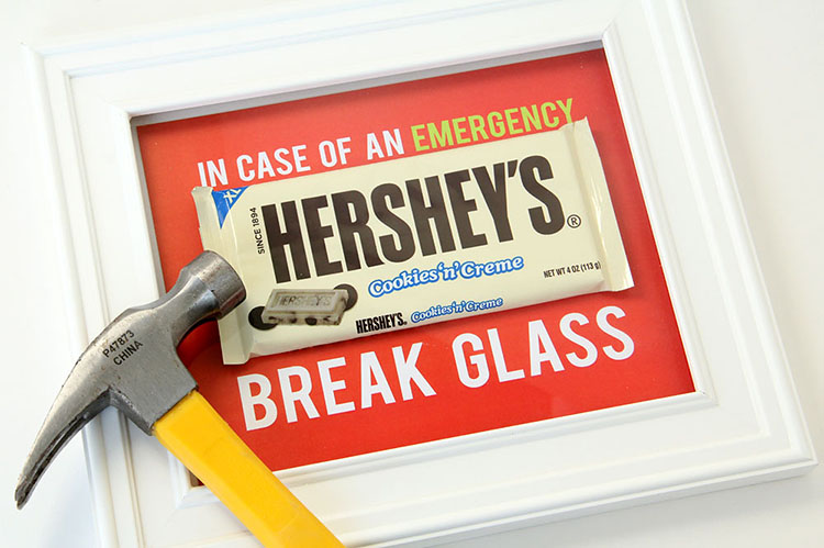 A candy bar inside of a picture frame to be used as funny white elephant gifts. | The Dating Divas 