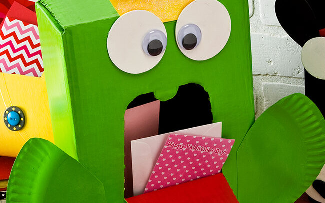 Bright green frog prince Valentine's Day craft made from a cardboard box | The Dating Divas