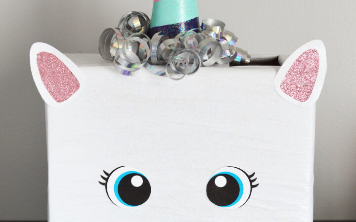 White unicorn valentines box with sparkly pink ears and bright blue eyes | The Dating Divas 