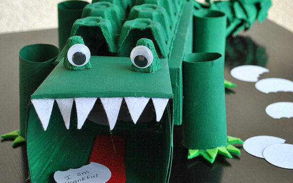 Dark green alligator made from an egg carton turned into a Valentine's Day box | The Dating Divas 