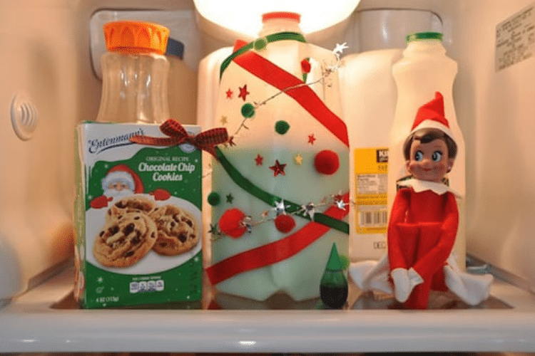 Elf on the shelf sits by some green-dyed milk | The Dating Divas