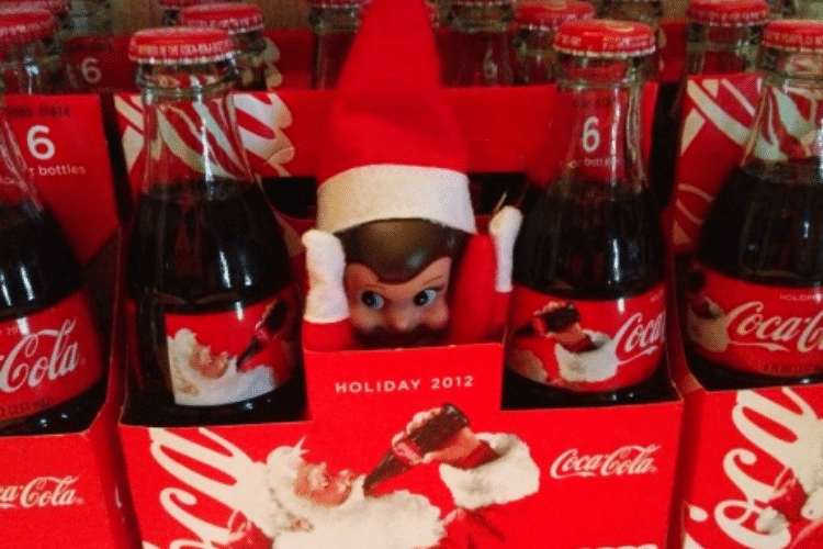 Elf on the shelf hiding among Coke bottles | The Dating Divas