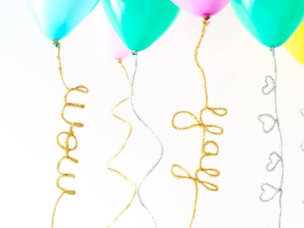 DIY bendable tails that can be added to balloons for birthday party decorations | The Dating Divas