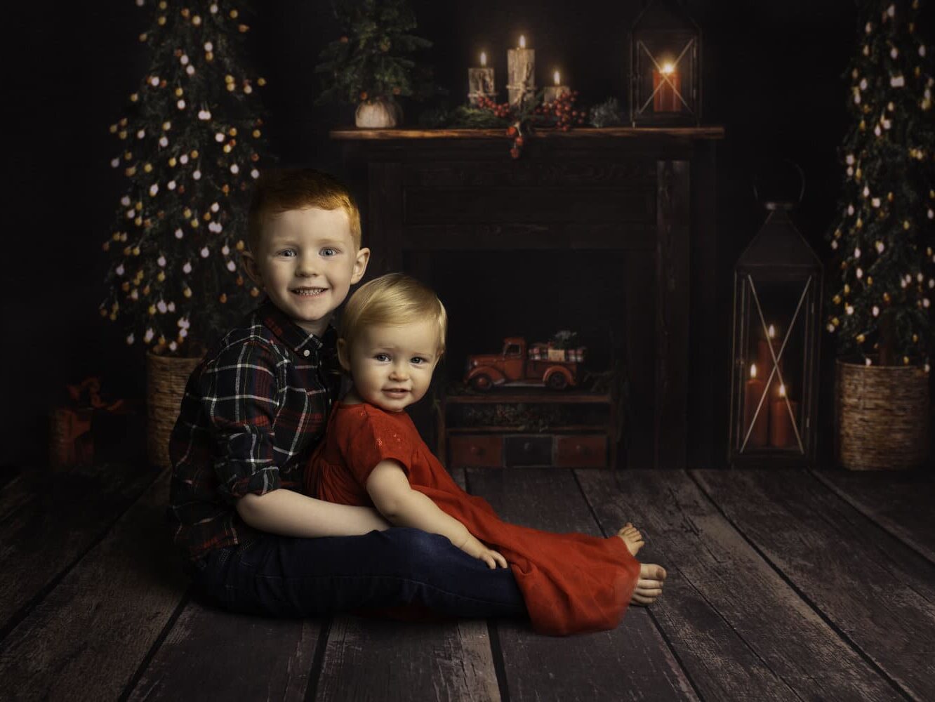 Family Christmas card ideas that have two kids in front of the fireplace | The Dating Dvas