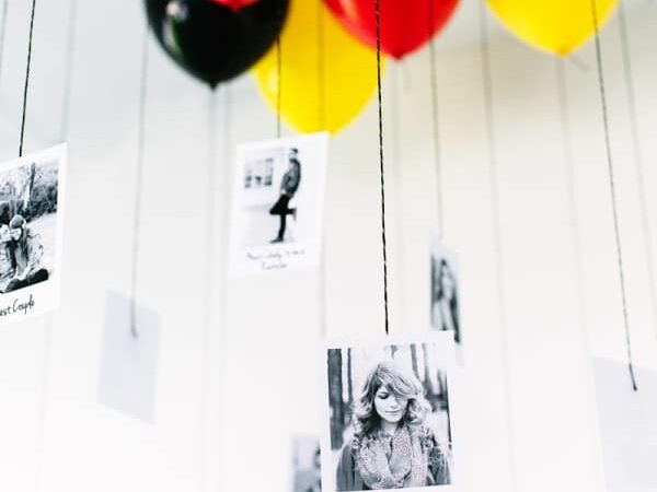 Hanging Polaroid photos at the end of balloon strings makes for a memorable birthday party idea | The Dating Divas