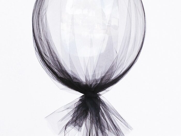 Tie tulle around balloons for elegant and classy birthday decorations | The Dating Divas