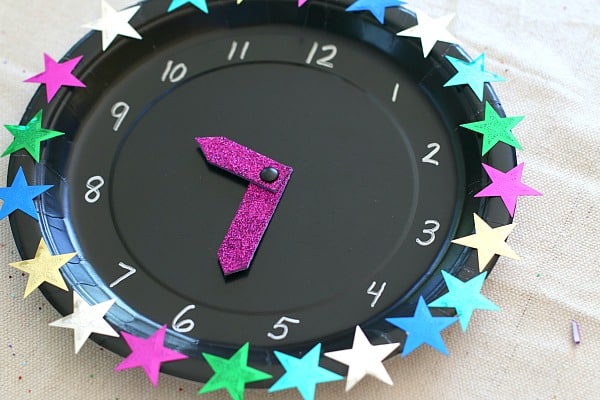 Colorful DIY clock craft for kids for New Year's party ideas | The Dating Divas