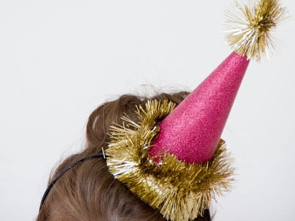 DIY glitter party hats for kids for a New Year's Eve party | The Dating Divas