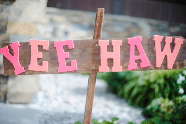 Cowgirl bridal shower with Yee-haw sign | The Dating Divas
