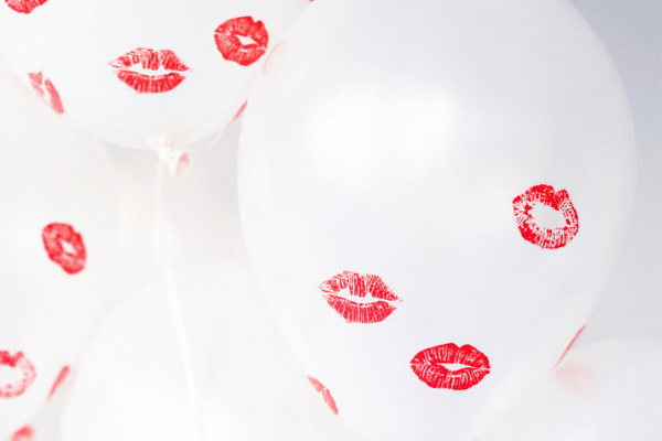 Clear balloons with lipstick kisses on them | The Dating Divas