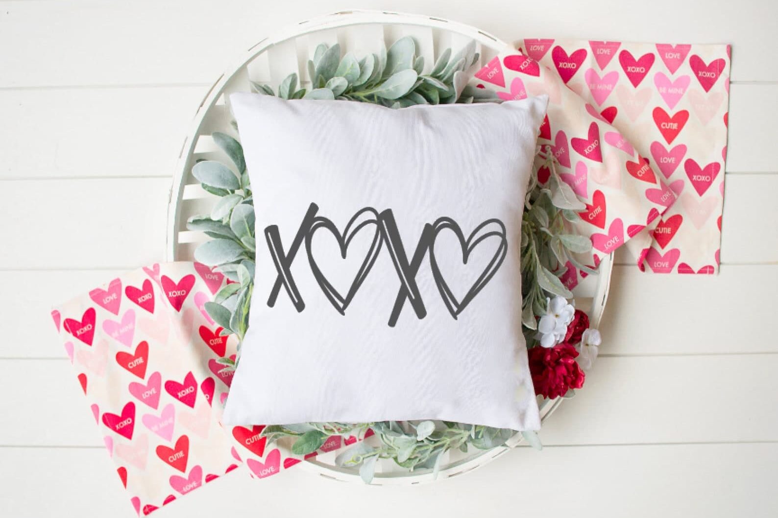 Buy a pillow cover instead of a whole pillow for easy Valentine's Day decor. | The Dating Divas