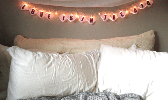 Glamping at home with s'mores and twinkle lights make a perfect Valentine's Day gift for him! | The Dating Divas 