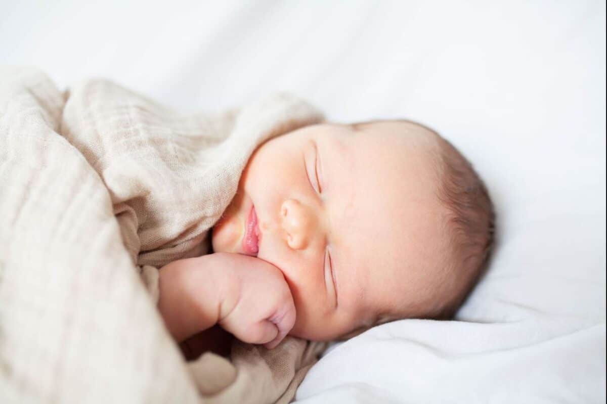 Catch a photo of those sweet little hands on their chubby cheeks in newborn pictures | The Dating Divas