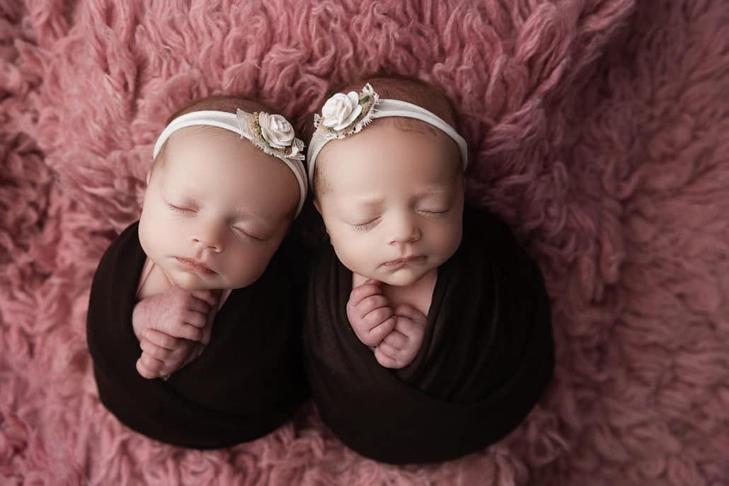 Newborn baby twin girls look cozy all swaddled up for their photo session | The Dating Divas