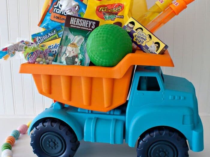 Adorable toddler boy Easter basket idea in a dump truck | The Dating Divas