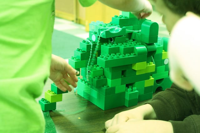 Children building a green leprechaun trap out of Legos | The Dating Divas