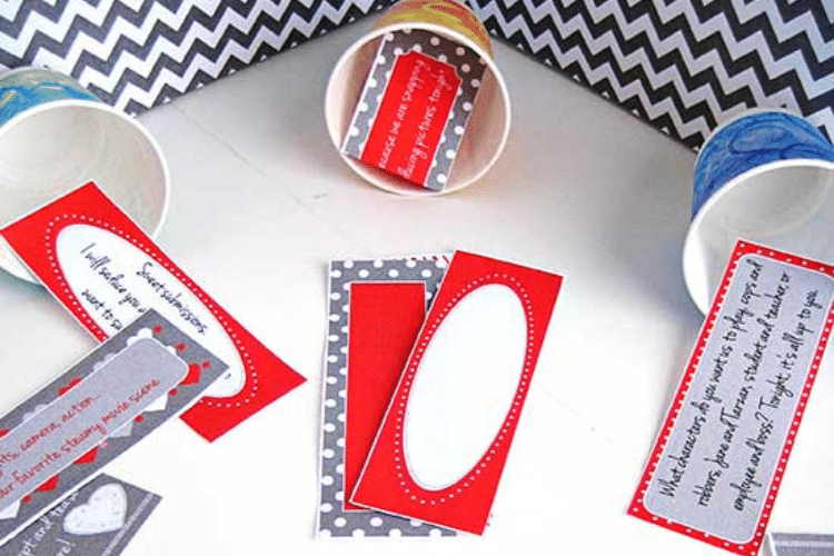 Cups holding slips of paper for Hot For You Punch Card - the perfect Valentine's Day idea | The Dating Divas