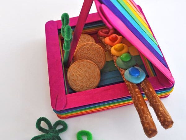 A popsicle stick leprechaun trap filled with cookies and other treats | The Dating Divas
