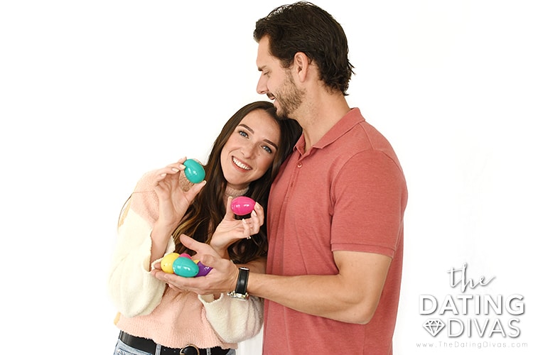 Couple taking cute Easter photos with free printable Easter egg hunt inserts | The Dating Divas