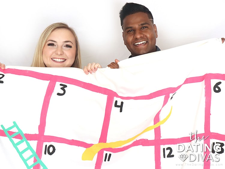 DIY bed sheet game held by a couple looking forward to playing together | The Dating Divas